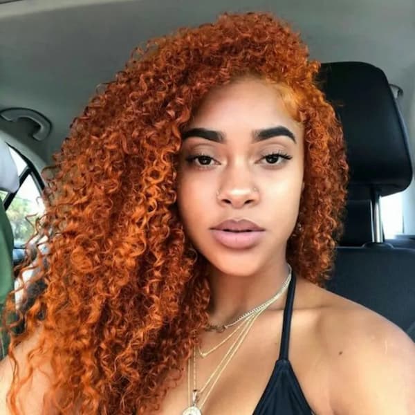 Red-Orange Curls With Deep Side Part