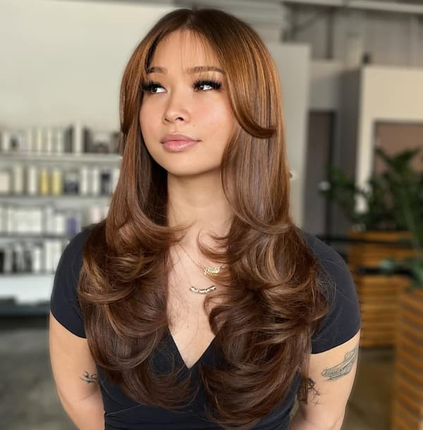 Wispy Layered Haircut with Curtain Bangs