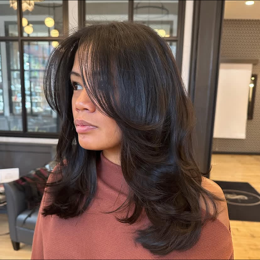Mid-Length Layered Haircut with Feathered Ends